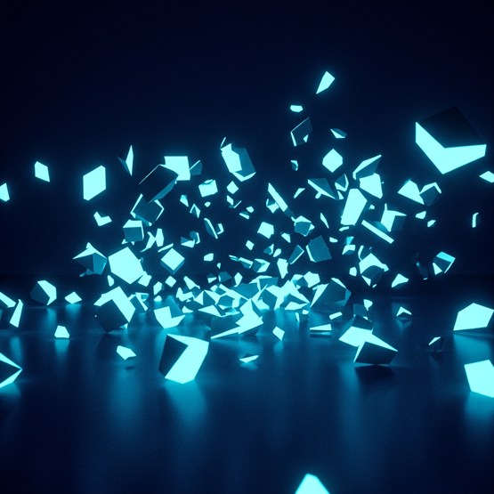 Clean geometric shards of one structure scattered and settling across a dark floor, dense at the center where the whole used to be